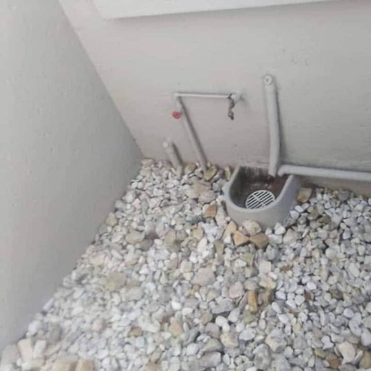Outdoor drainage system corner view after blockage clearance by Sphapower Plumbing